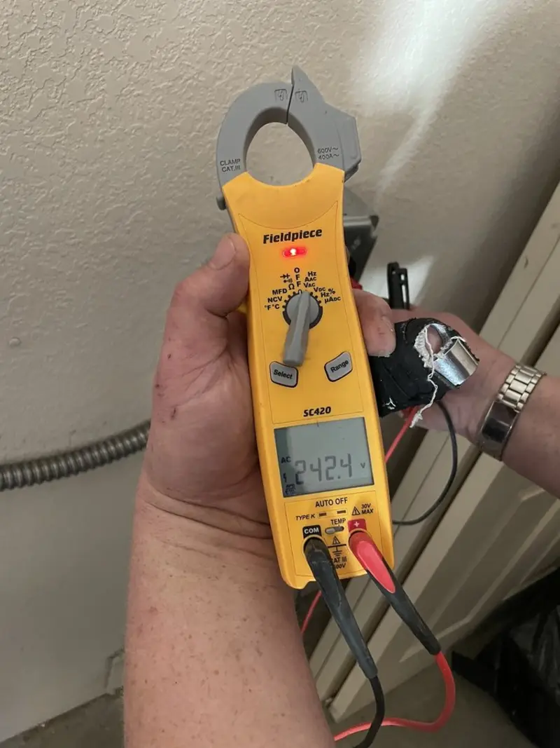 Voltage testing with clamp meter during Recessed Lighting Installation in DeBary